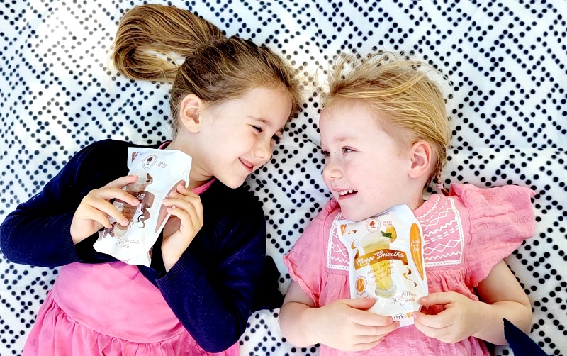 Two girls enjoying milk